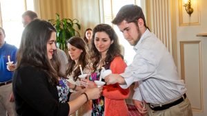 Twenty one student out of a total of forty one attended the Lafayette College's chapter of Psi Chi induction ceremony. New members are given a symbolic candle to hold during the ceremony.